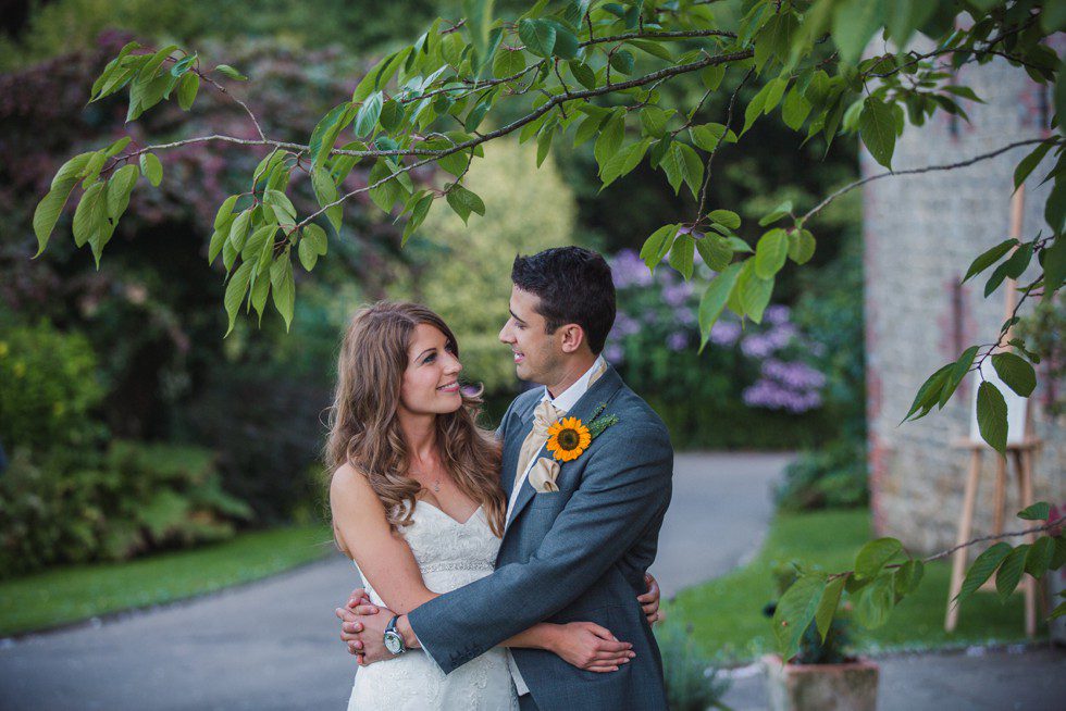 bride and groom embrace at their Batholomew Barn wedding