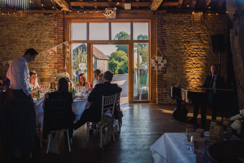 Pianist Danny Mills on piano at a Grittenham Barn wedding