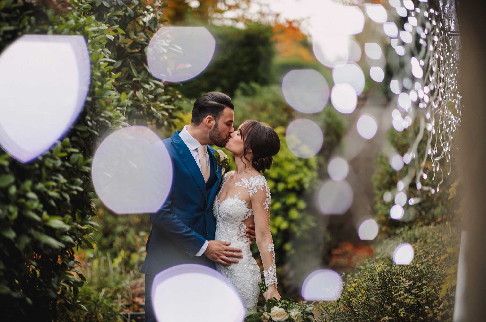 Bride and groom kiss at the Random Hall Hotel