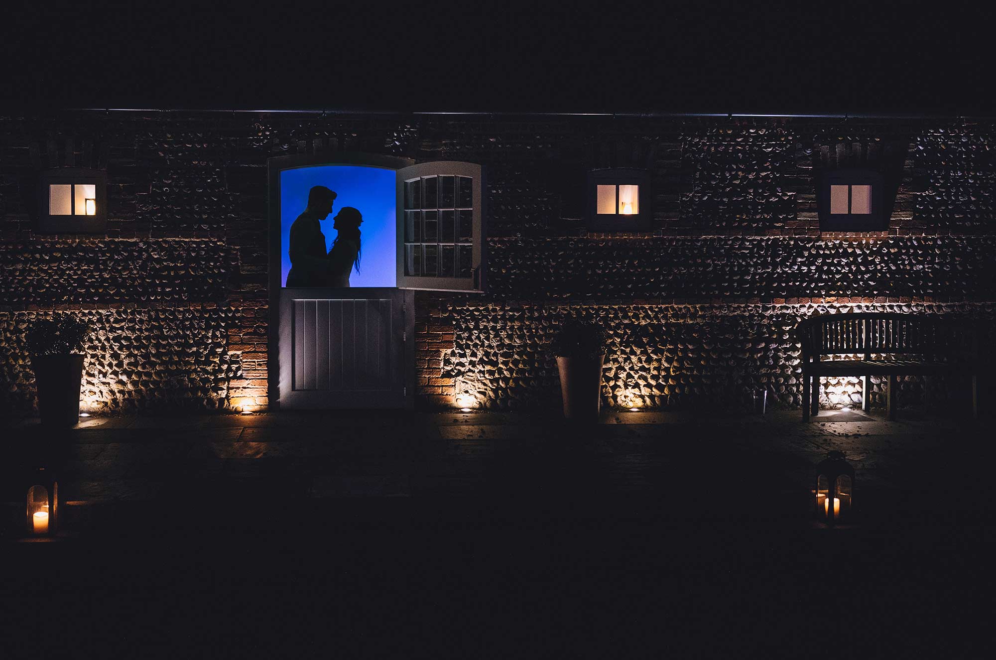 Bride and groom silhouette shot in dairy at Southend Barns 