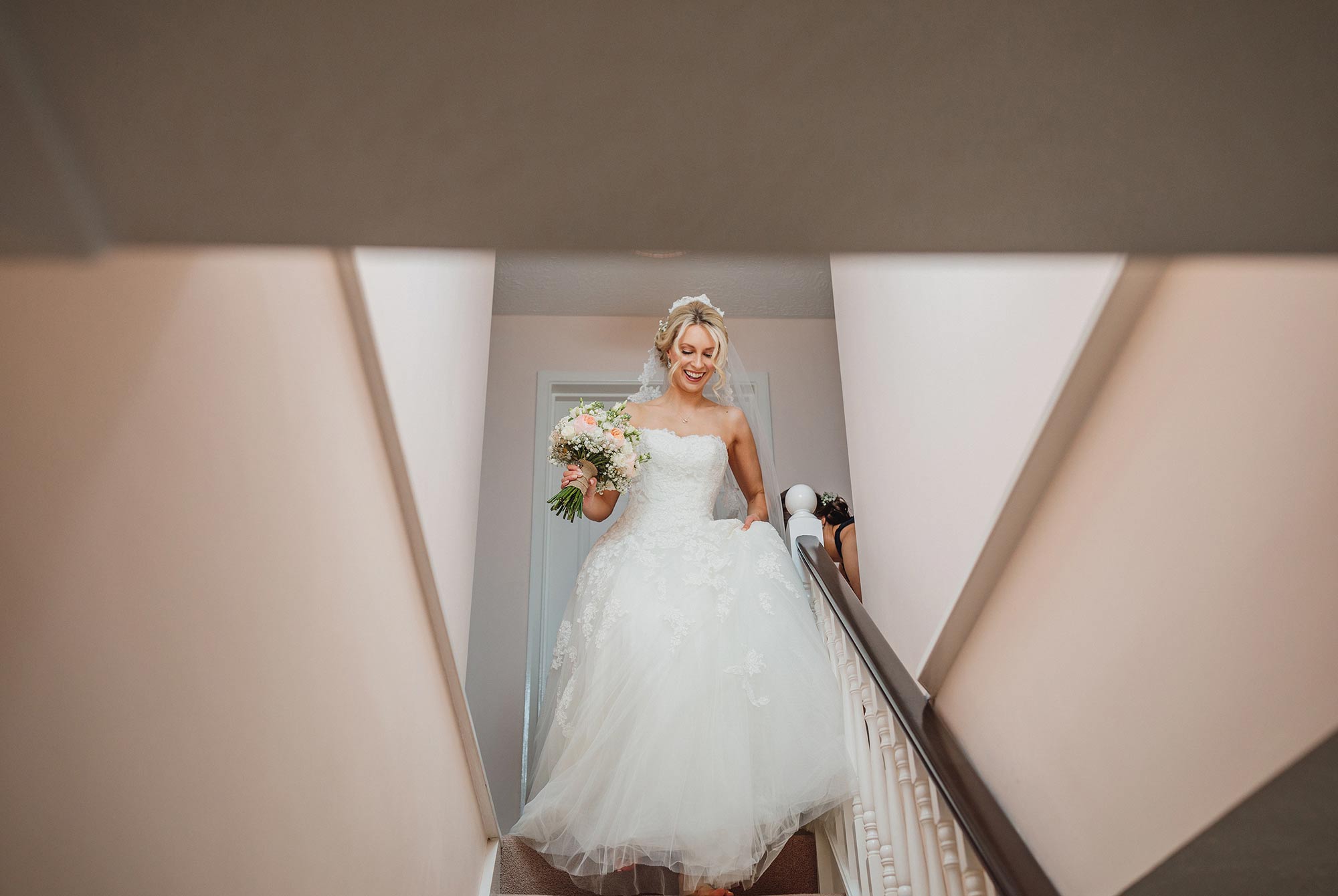 bride coming down the stairs