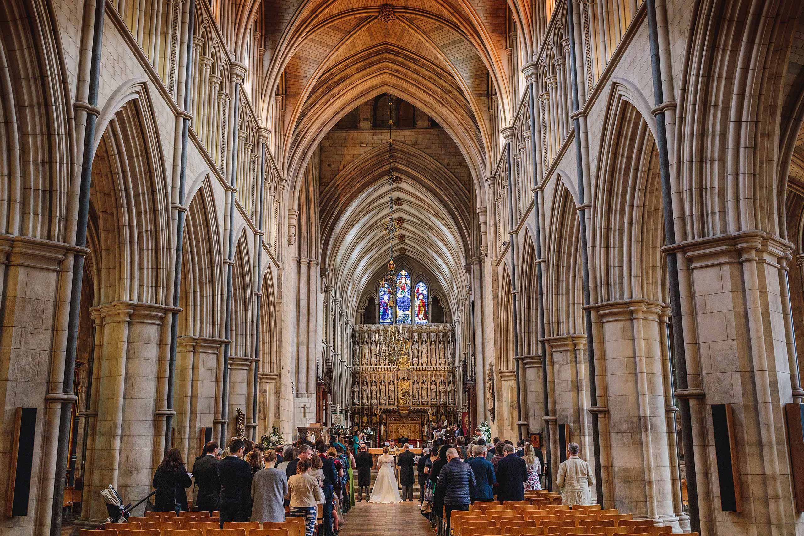 Wide rear view of a Southwark Cathedral wedding ceremony