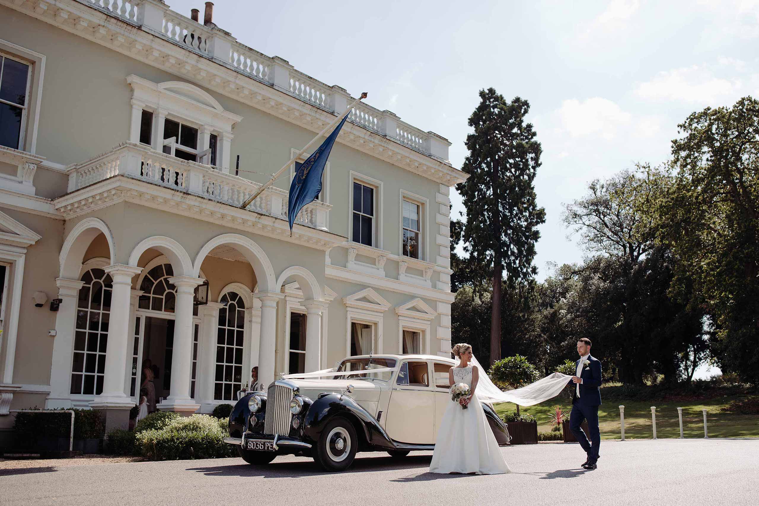 Bride and groom arrive at Burhill Golf Club
