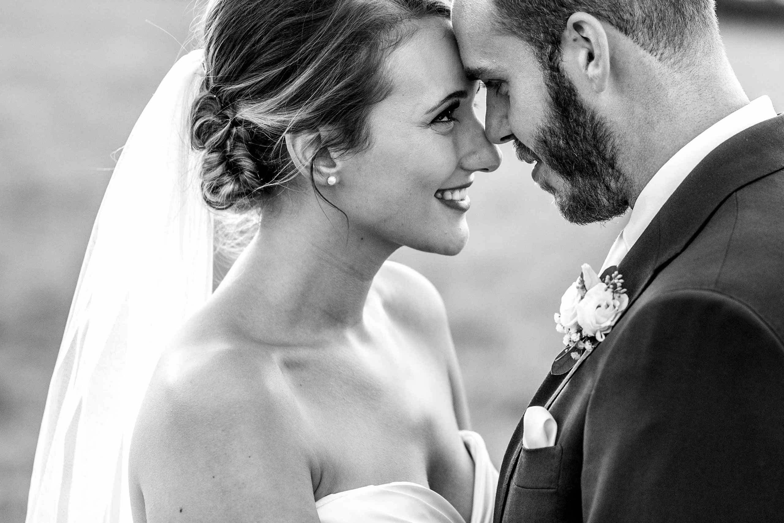 Bride and groom tender moment touching heads at their Upwaltham Barns wedding