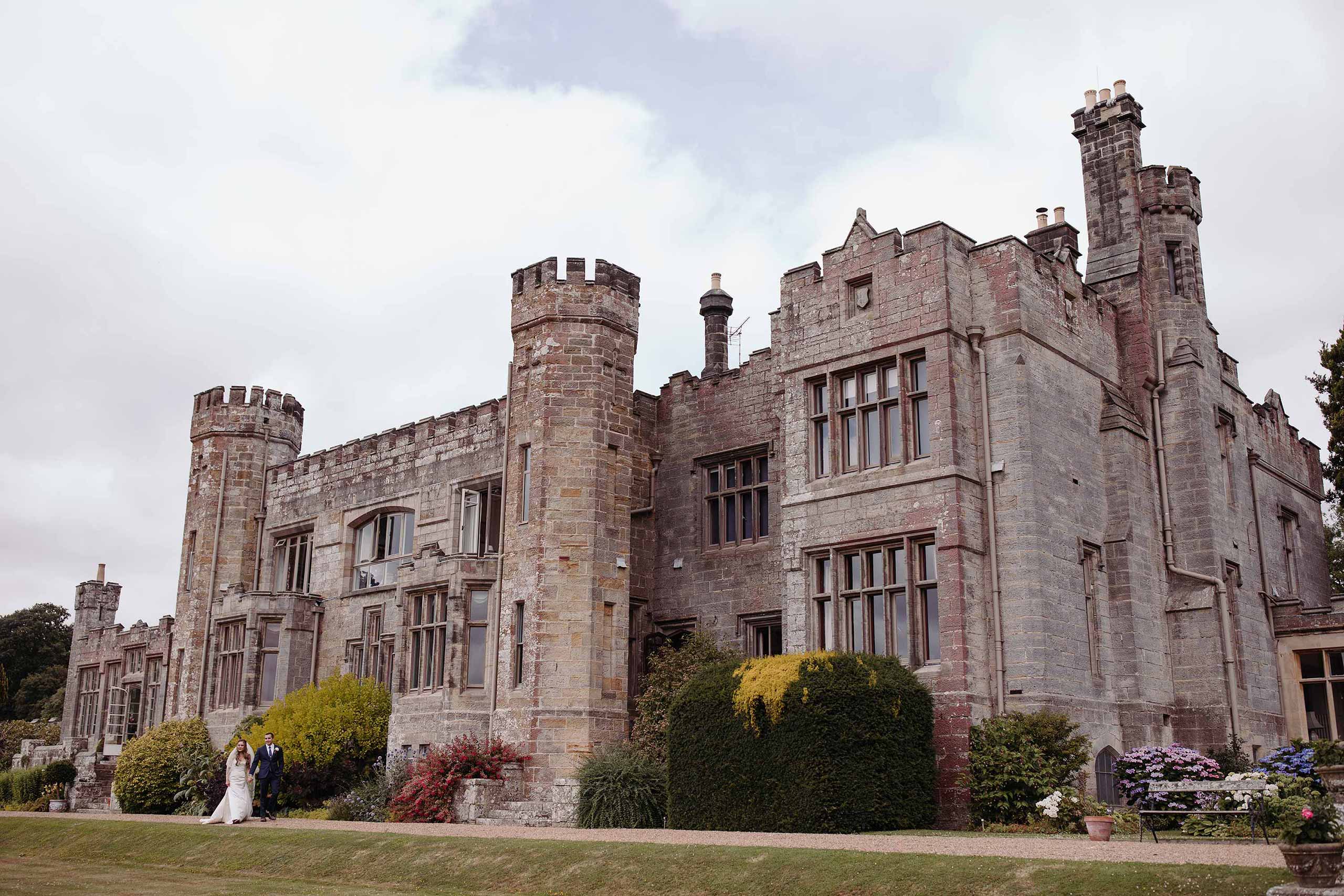 Bride and groom outside Wadhurst Castle