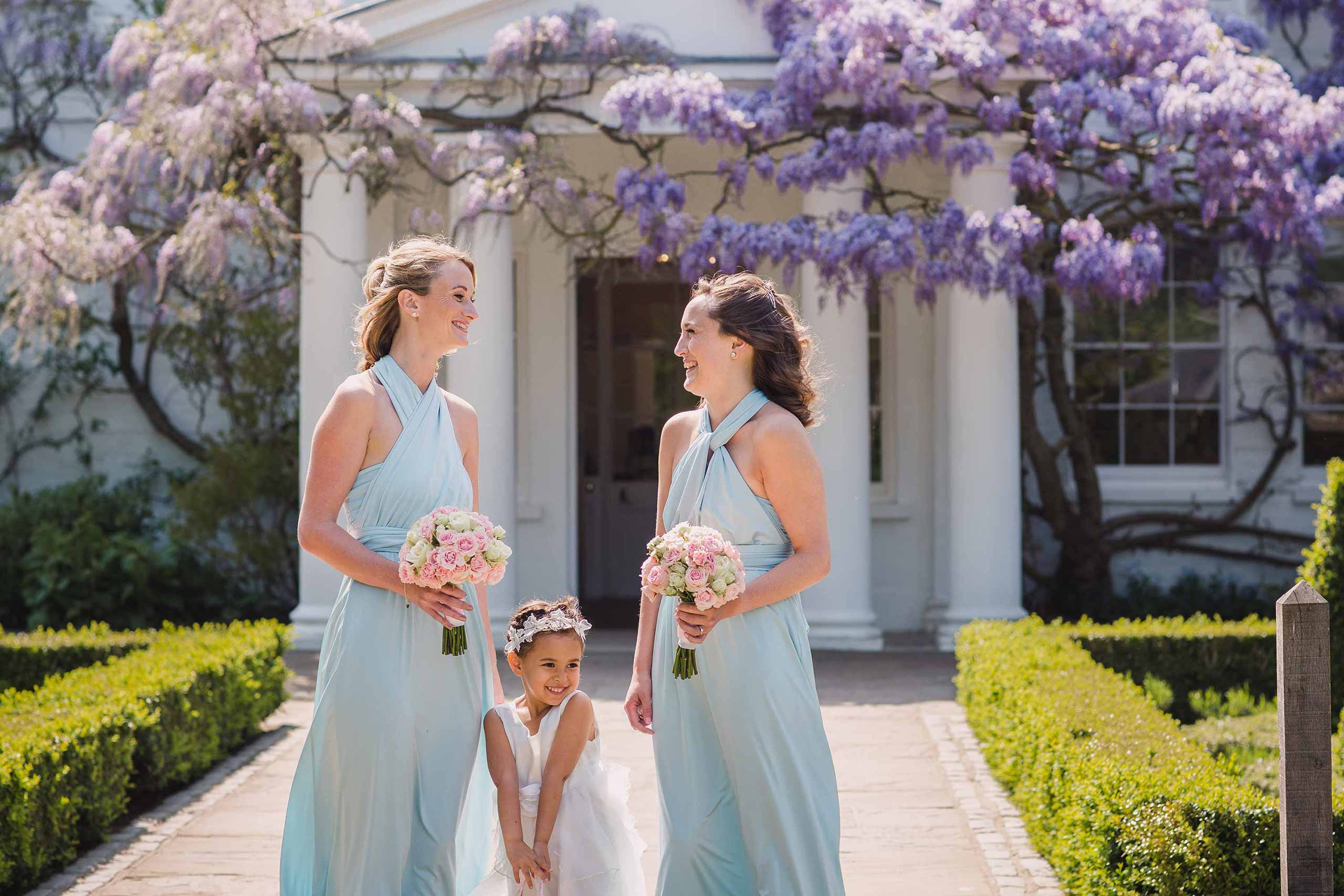 bridesmaids and flower girl outside Pembroke Lodge wedding venue