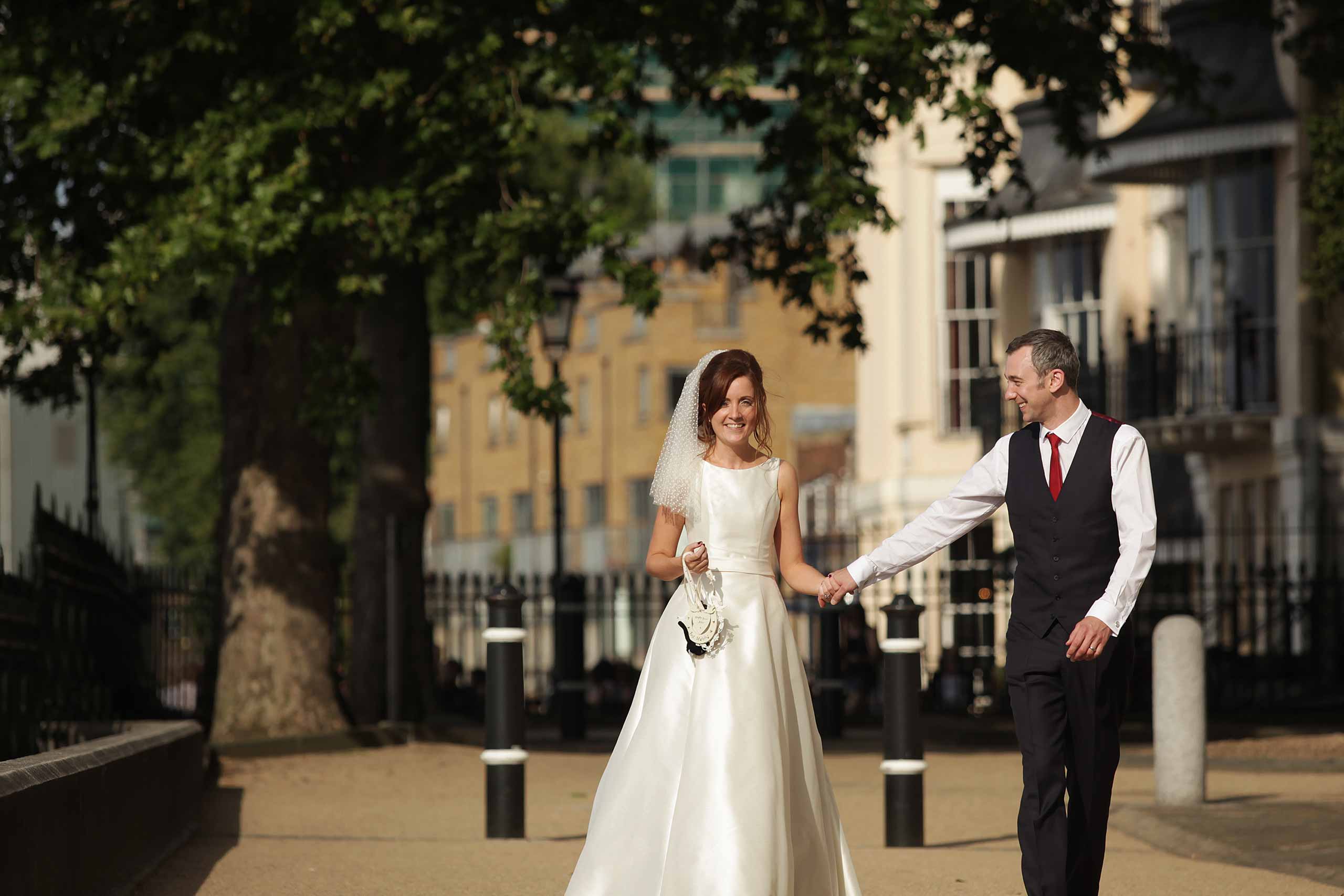 Bride and groom walking together in Greenwich