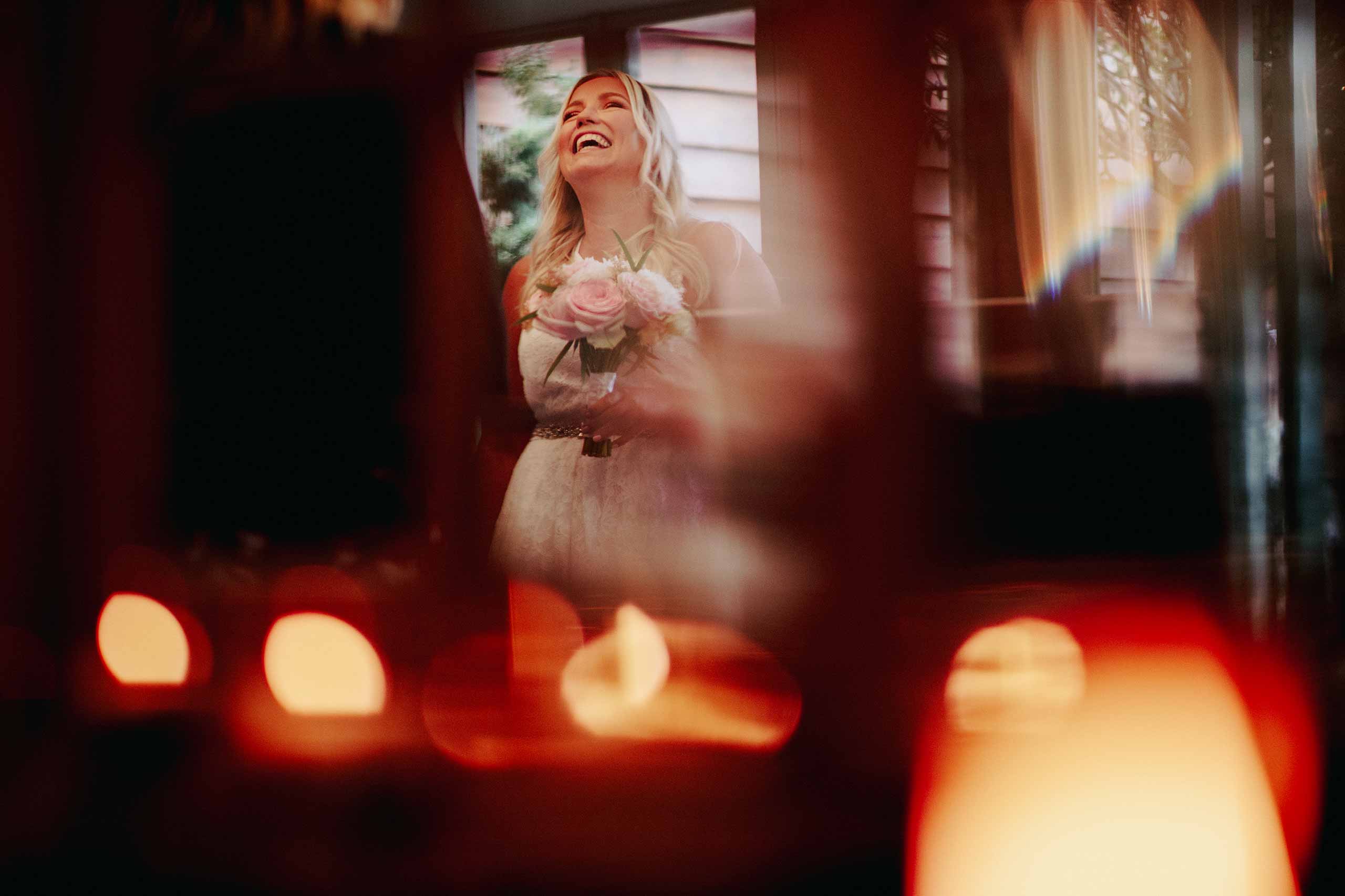 Bride laughing ahead of her Pangdean Barn wedding ceremony