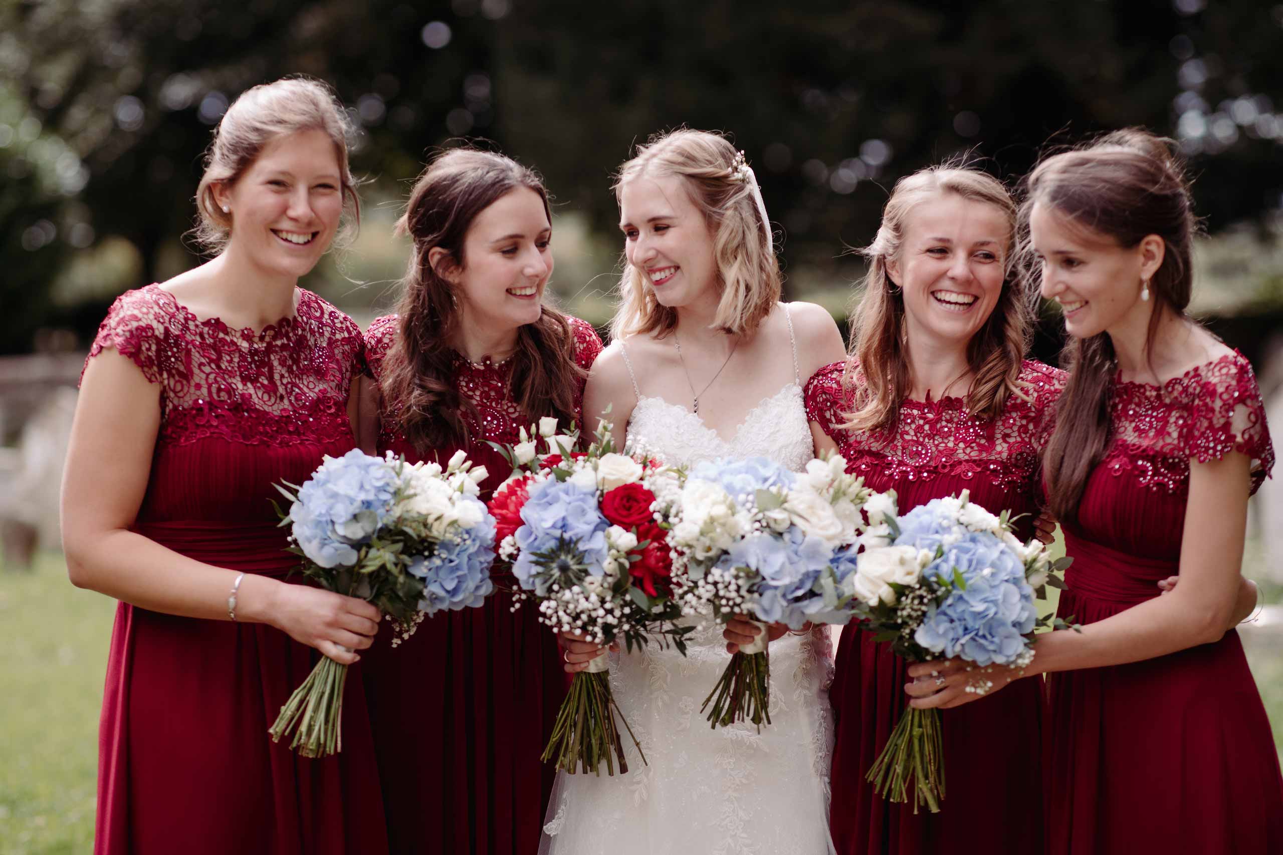 Bride moment with bridesmaids during an Intimate lockdown wedding ceremony at Walberton Church, Sussex