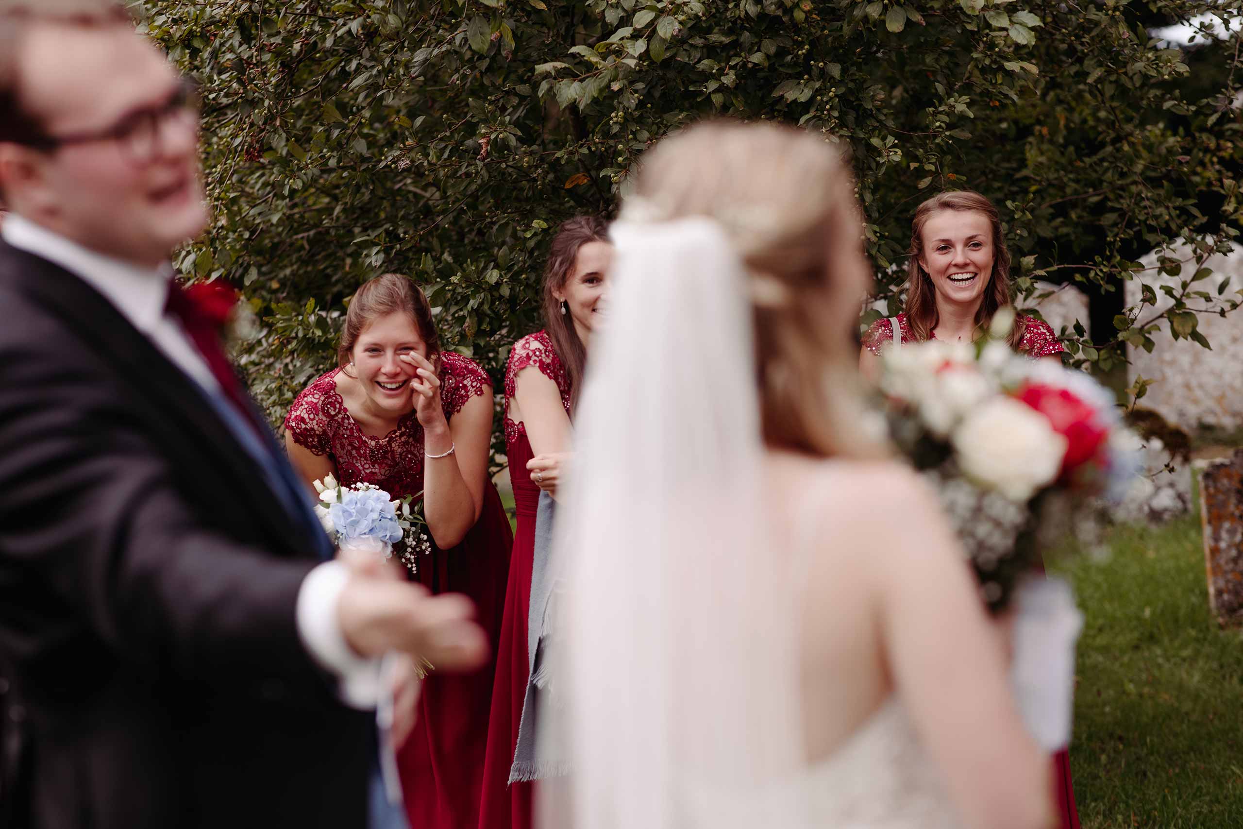 Bride's speech and bridesmaid reactions during an Intimate lockdown wedding ceremony at Walberton Church, Sussex