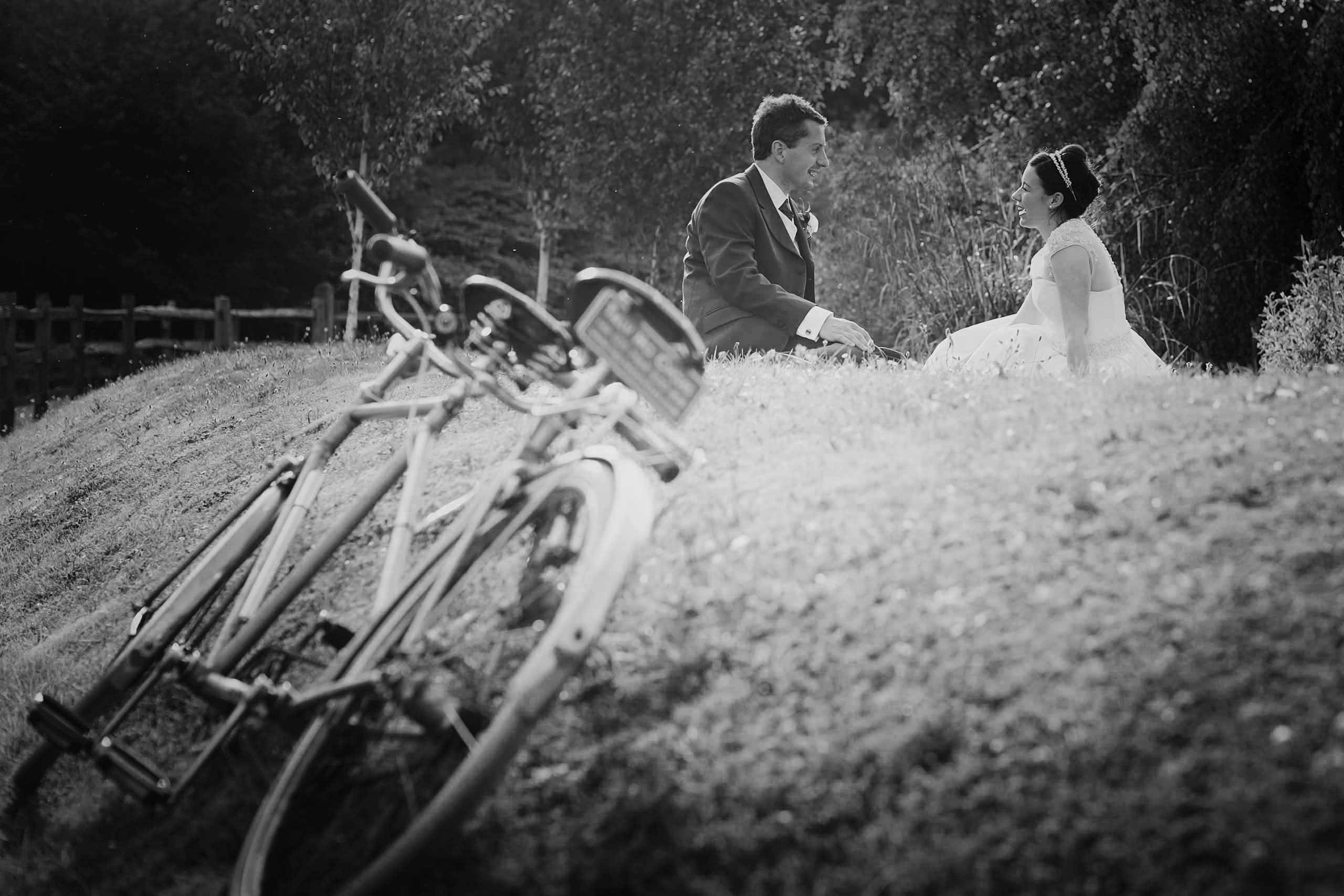 50's bride and groom with a tandem at their coltsford mill wedding