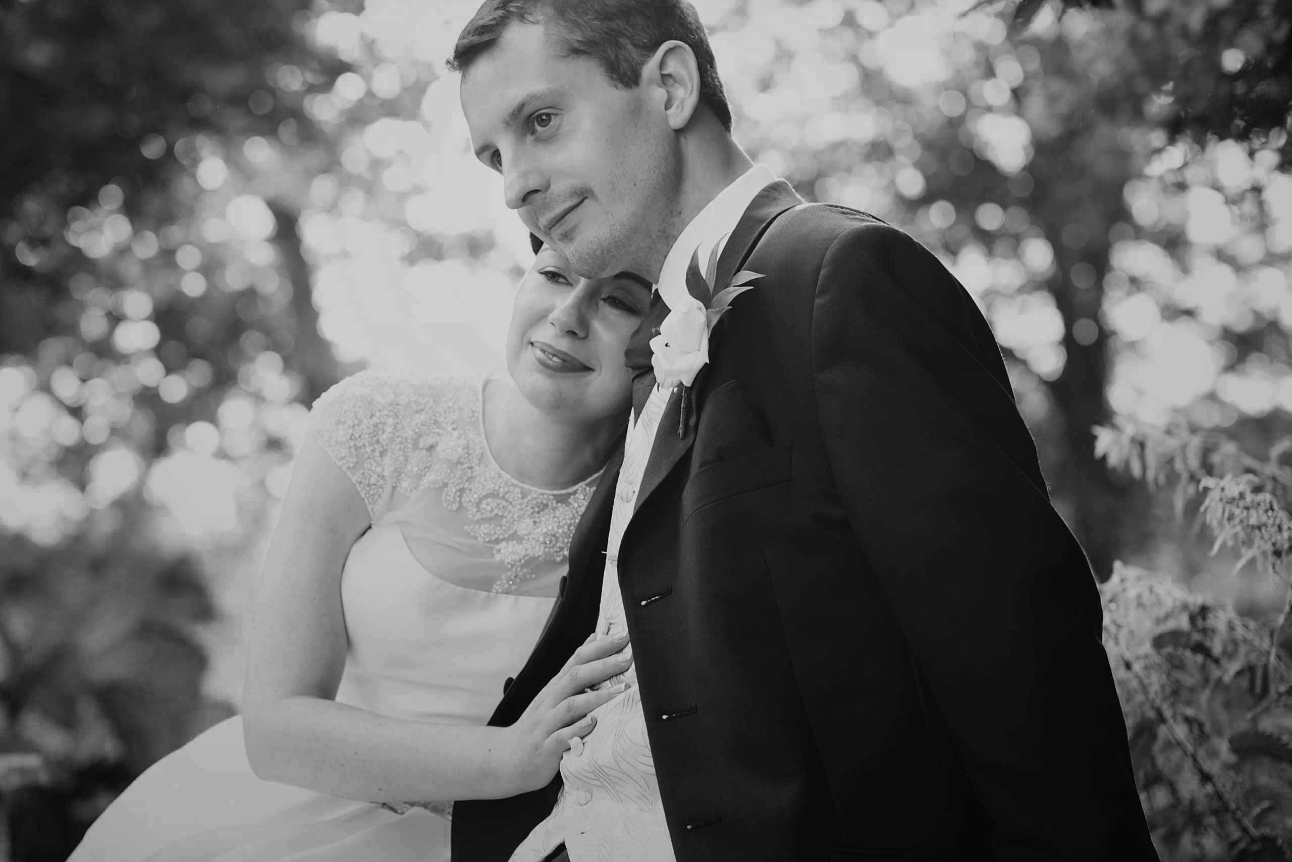 50's bride and groom sitting enjoying the views together at their coltsford mill wedding