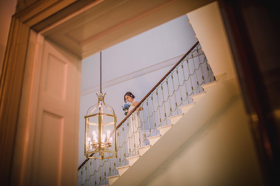Bride coming down the staircase at 28 Portland Place London