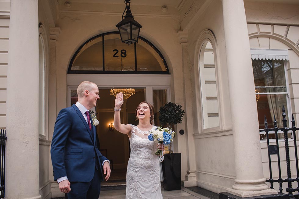 Bride and groom leave their London wedding ceremony