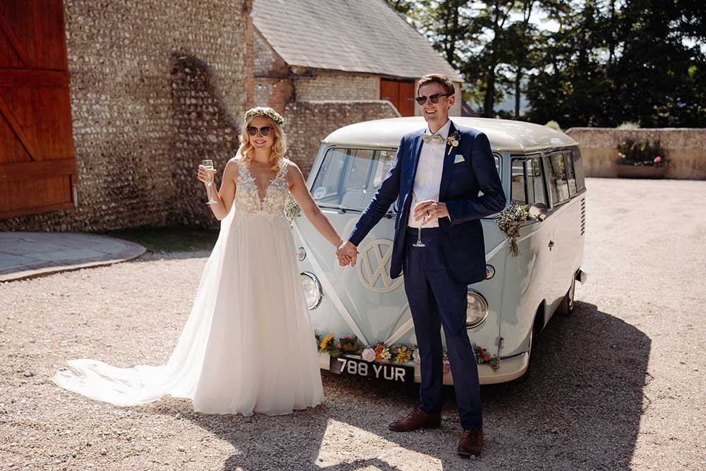 wedding couple with their VW Campervan at Cissbury Barns 