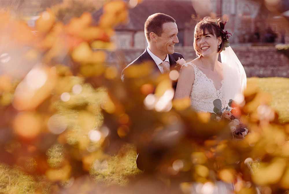 Bride and groom laughing at golden hour at Farbridge