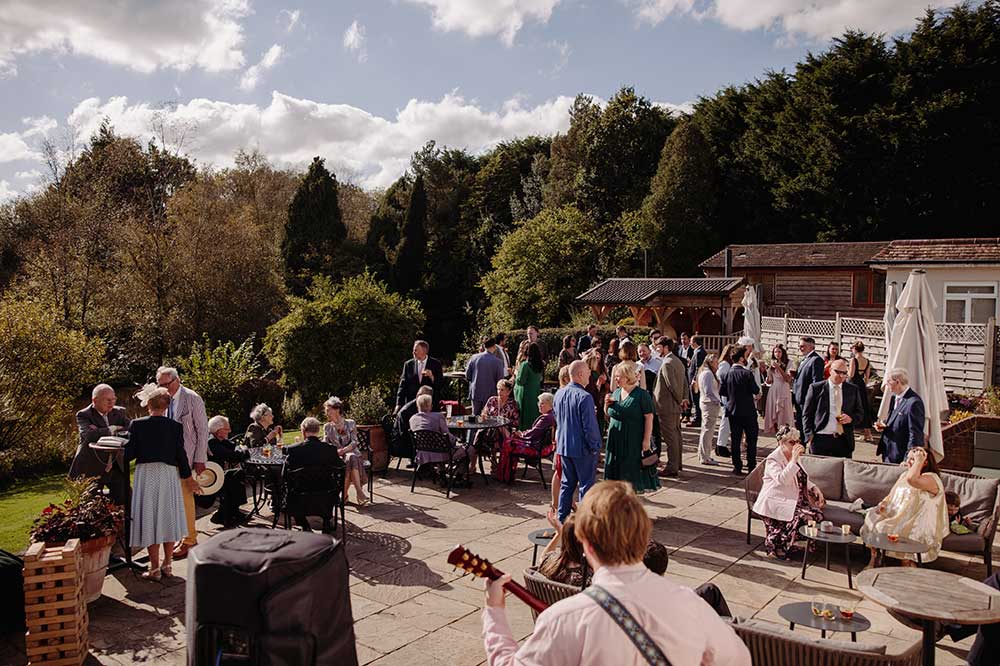 Wedding drinks reception with guitarist at Brookfield Barn
